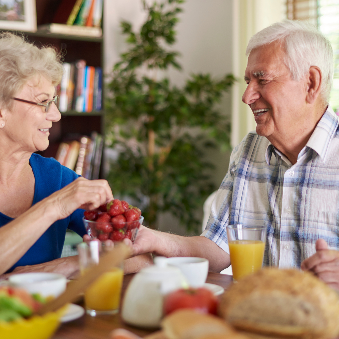 Photo of two seniors eating