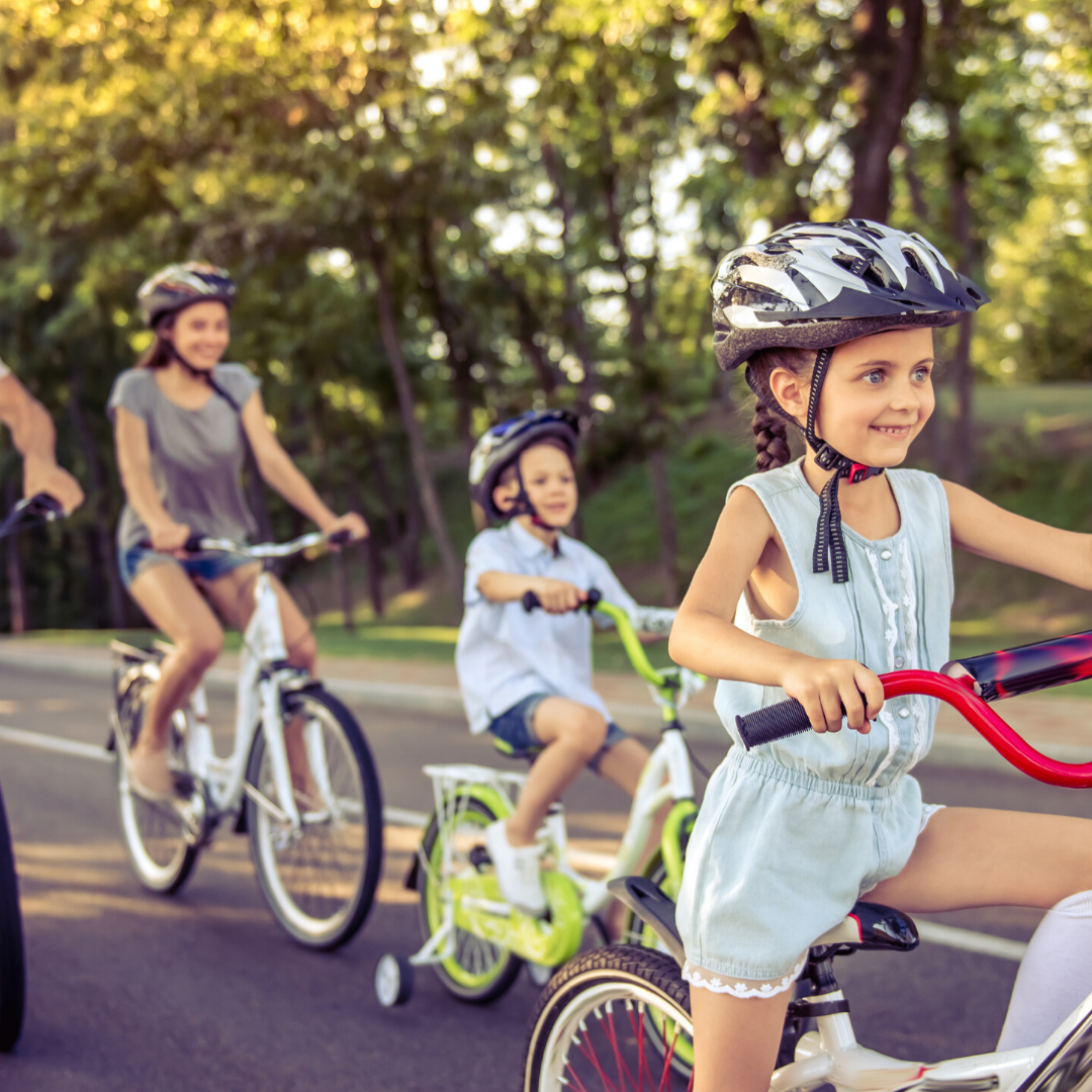 Photo of family riding bikes