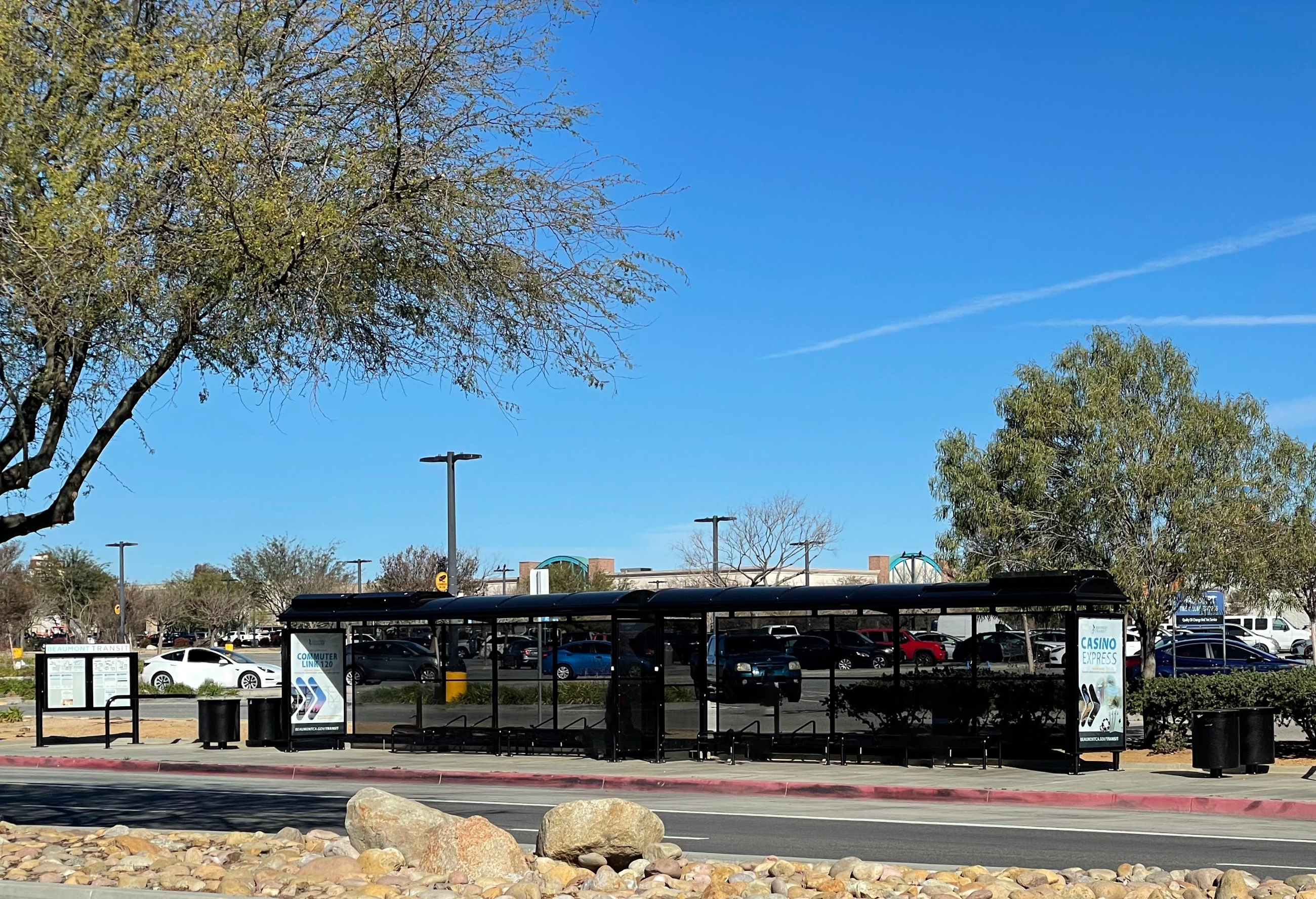 The image shows the Beaumont Walmart bus stop and the surrounding landscape. 